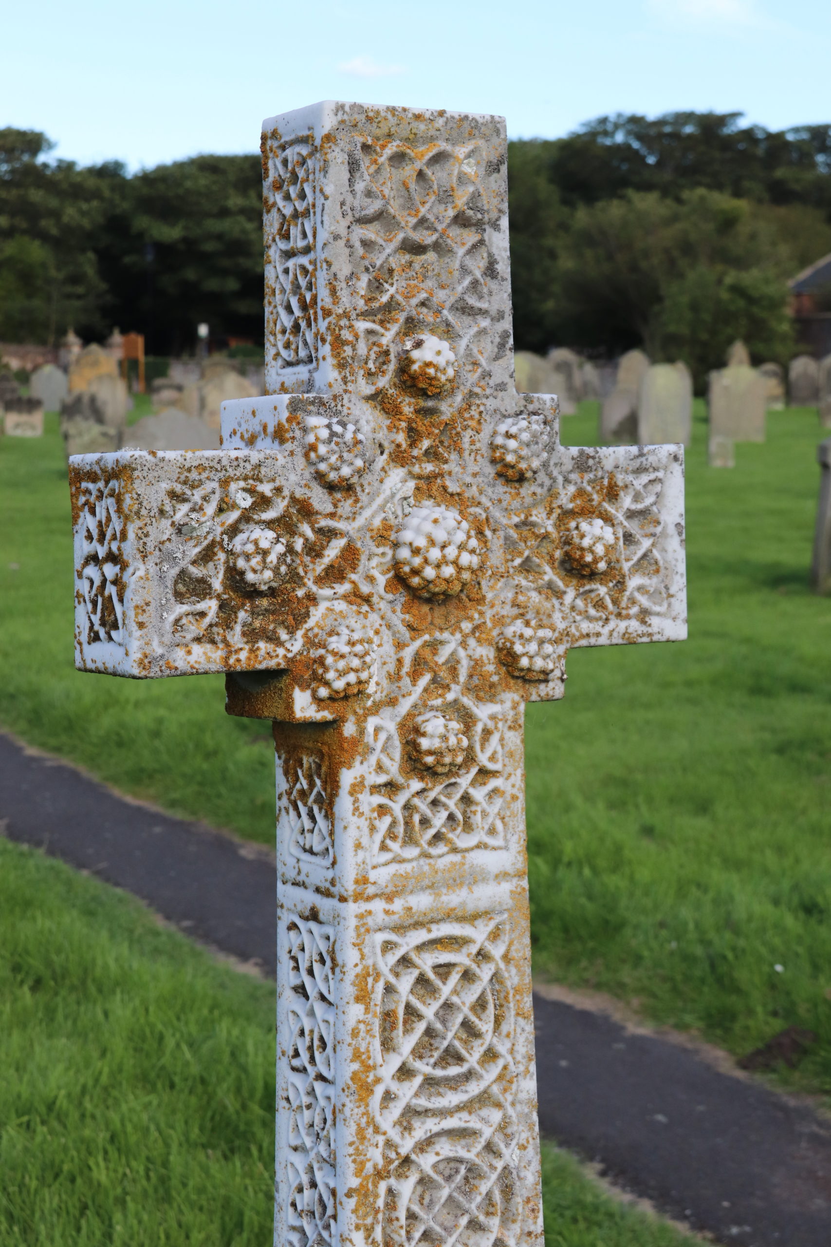A celtic cross styled tomb stone in St Aidan's church yard. 