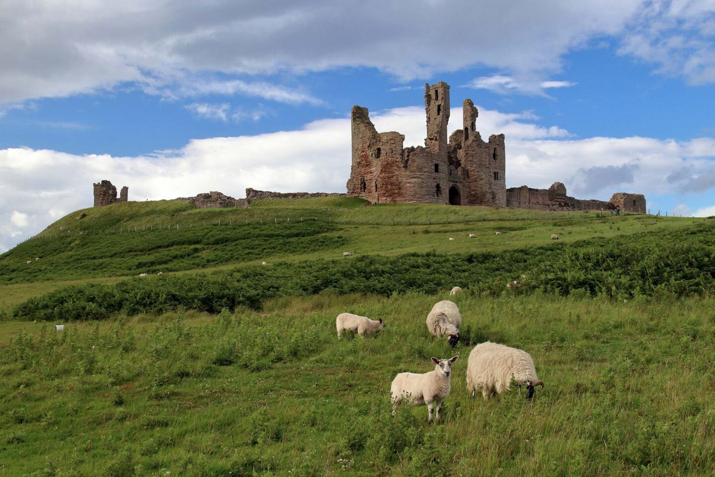 Dunstanburgh Castle, close to the village of Craster on the Northumberland coast